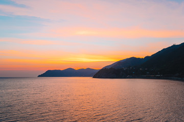 Stunning view of the beautiful and cozy village of Manarola in the Cinque Terre Reserve at sunset. Liguria region of Italy.