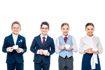 smiling schoolchildren pretending to be businesspeople holding coffee cups and looking at camera Isolated On White