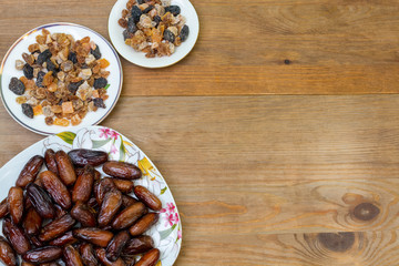 bowl of mixed dry fruits and nuts on wooden table