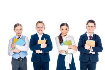 happy schoolchildren pretending to be businesspeople with books Isolated On White