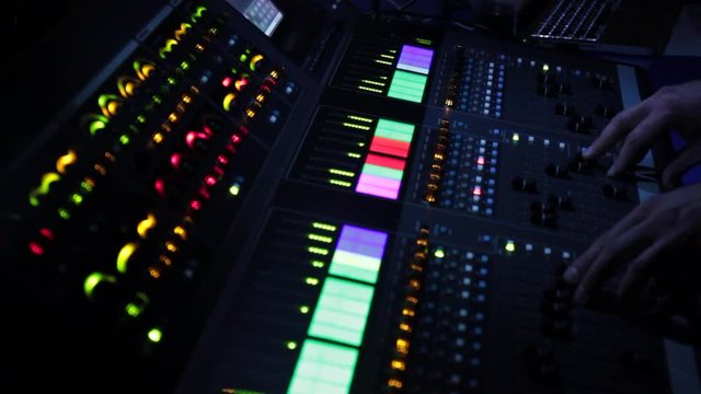 Audio mixer at the concert controls the music