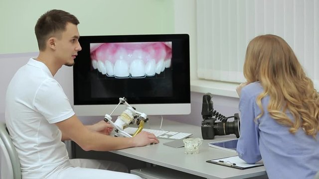 Professional dentist is receiving patient in dental clinic