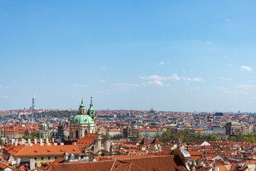 Fototapeta na wymiar Outdoor sunny aerial top panoramic view of rooftop old town Prague skyline from observation deck near Prague Castle and staircase and barckground of farther Towerpark Praha in Prague, Czech Republic.