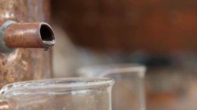 Antique copper bowl used for herbs distillation to produce essential oil. Close up.