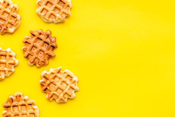 Breakfast with Belgian waffles on yellow background top view mock up