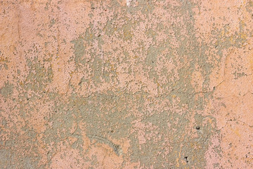 Old grunge cracked vintage dirty pink concrete and cement mold texture wall or floor background with weathered paint and scratches