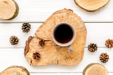 coffee, wooden stumps and pine cones for blog background top view