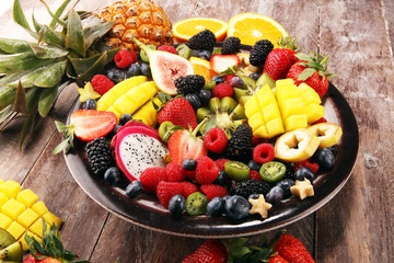 salad with fresh fruits and berries. healthy spring fruit salad  with strawberries