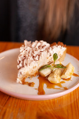 Traditional banoffee pie with whipped cream and caramel sauce