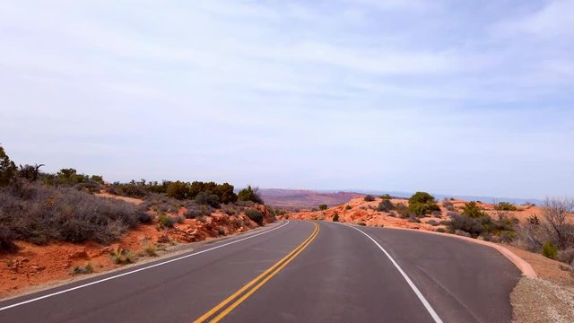 Road through Arches National Park in Utah - UTAH, UNITED STATES OF AMERICA - APRIL 1, 2019
