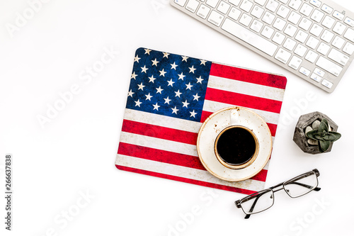 Memoral day of United States of America with flag, keyboard, glasses and coffee on white background top view