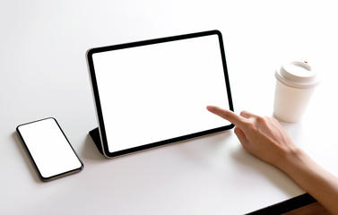 Tablet and smartphone screen blank on the table mock up to promote your products. Concept of future and trend internet for easy access to information.