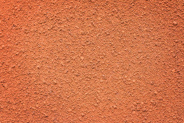 Rough wall of red color as texture.  Wall concrete backgrounds textured. 