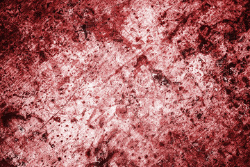 Red color grunge scratched metal texture.
