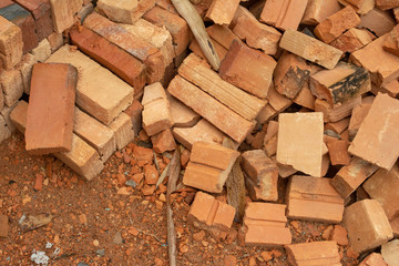 pile of bricks which is prepared for construction. red brick wall at the construction site.