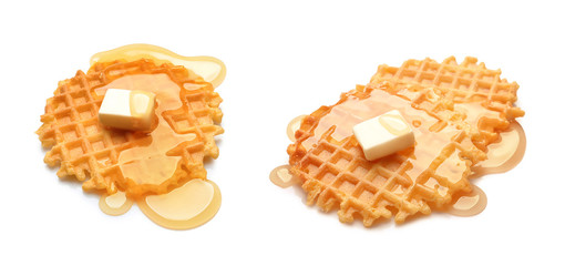 Set of delicious waffles with butter and honey on white background
