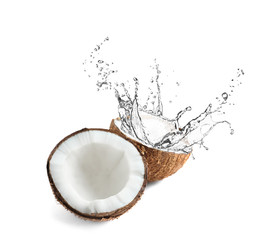 Halves of coconut on white background
