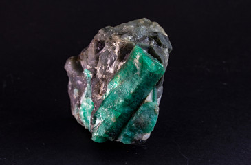 Close up of sample of Emerald mineral. A gemstone and a variety of the mineral beryl colored green...