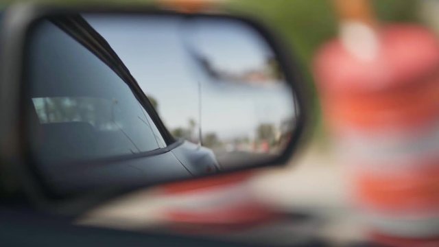 Shot of a side mirror of a Ford Mustang in movement - slow motion.