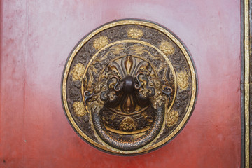 Obraz na płótnie Canvas The etching design on bronze metal decorate the handle for the door to entrance Guru Lhakhang Monastery, Kathmandu, Nepal