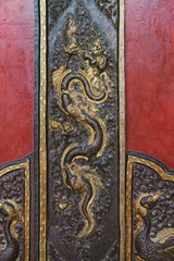 The etching design on bronze metal for decorate the door to entrance Guru Lhakhang Monastery.