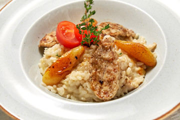 Grilled chicken with white rice. Light wooden background. Restaurant menu