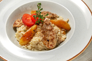 Grilled chicken with white rice. Light wooden background. Restaurant menu