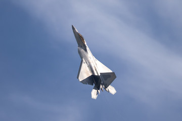 F-22 Raptor in beautiful light against clouds