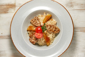 Grilled chicken with white rice. Light wooden background. Restaurant menu