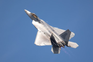 F-22 Raptor in beautiful light, with afterburners on