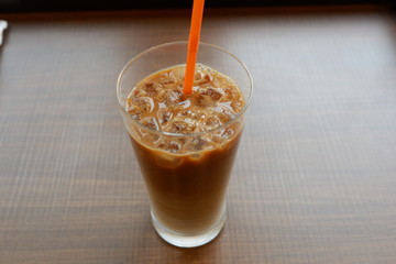 ice coffee on desk with straw