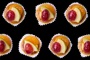 fruit tart on black background