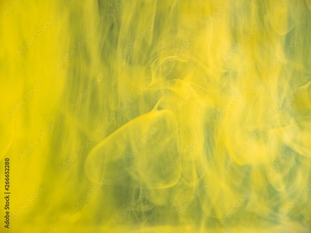 Poster droplets of acrylic paint dissolving into water, abstract background. close up view. blurred backgro