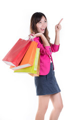 Colorful shopping vibes. Portraits of smiling Asian woman in Trendy clothes with a lot of shopping bags isolated on white.