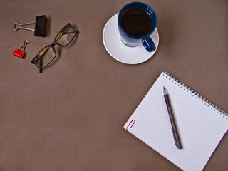 notebook, coffee Cup, glasses, office supplies