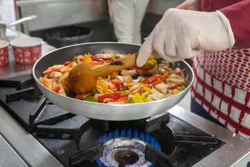 Cooking process in a pan with a cook