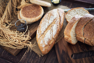 Naklejka premium Fresh Bread On Wooden Table.