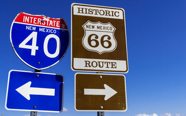 a group of Highway markers on historic highway 66 and interstate 40 in the American southwest