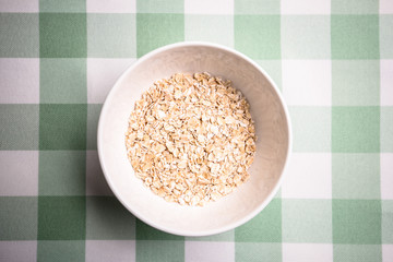 Healthy breakfast cereal oat flakes in bowl