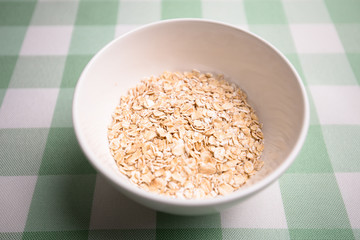 Healthy breakfast cereal oat flakes in bowl