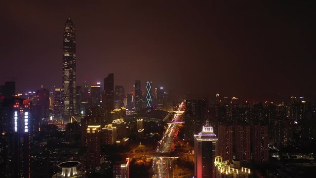 night time illumination flight over shenzhen cityscape street aerial panorama 4k china