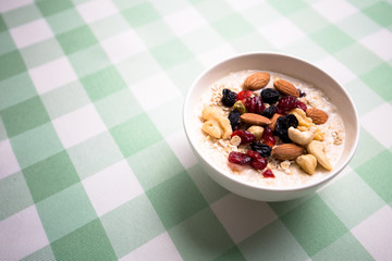 Healthy breakfast fresh granola muesli with milk and nuts