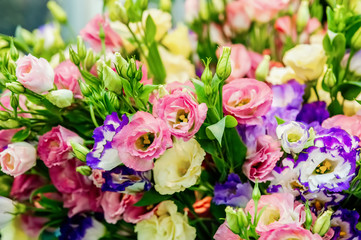 A large bouquet of eustoma in a flower shop is sold as a gift box. Farmer's market. Background.