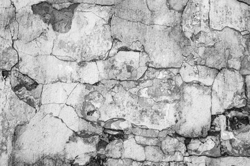Stone wall Textured abstract background of old treated stone. Black and white
