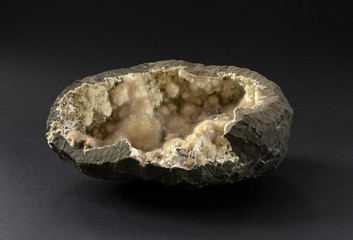 Okenite mineral sample from India. Small white super sharp "cotton ball" formations within basalt geode. Clusters of straight, radiating, fibrous crystals that are both bendable and fragile.