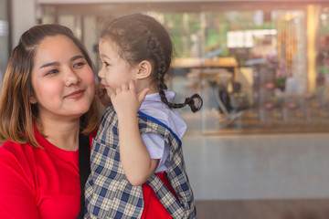 Asian Mother and Child smiling and hugging With love on blurred background for lifestyle family joyful happiness image.