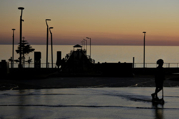 Silhouette of Henley Beach square and pier at dusk in Adelaide South Australia.
