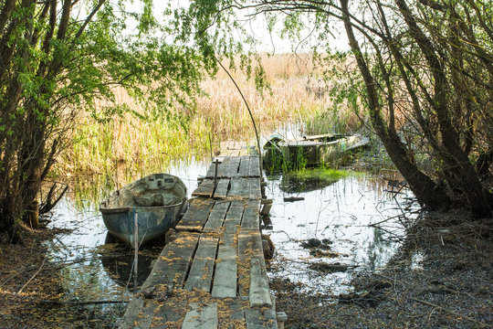 old plank dilapidated berth and wooden old boat