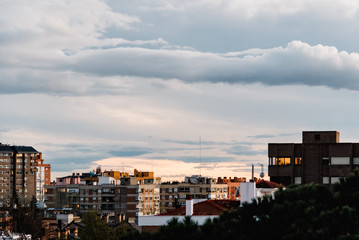 Fototapeta na wymiar Cityscape of residential district against cloudy sky