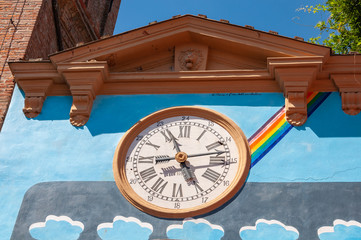 Dozza Italy: Detail of the ancient village with wall clock. City in the Emilia Romagna region famous for its murals and the castle